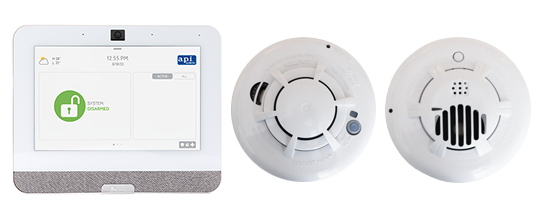 Home fire protection Qolsys IQ4 Touch Panel next to a smoke detector and carbon monoxide detector